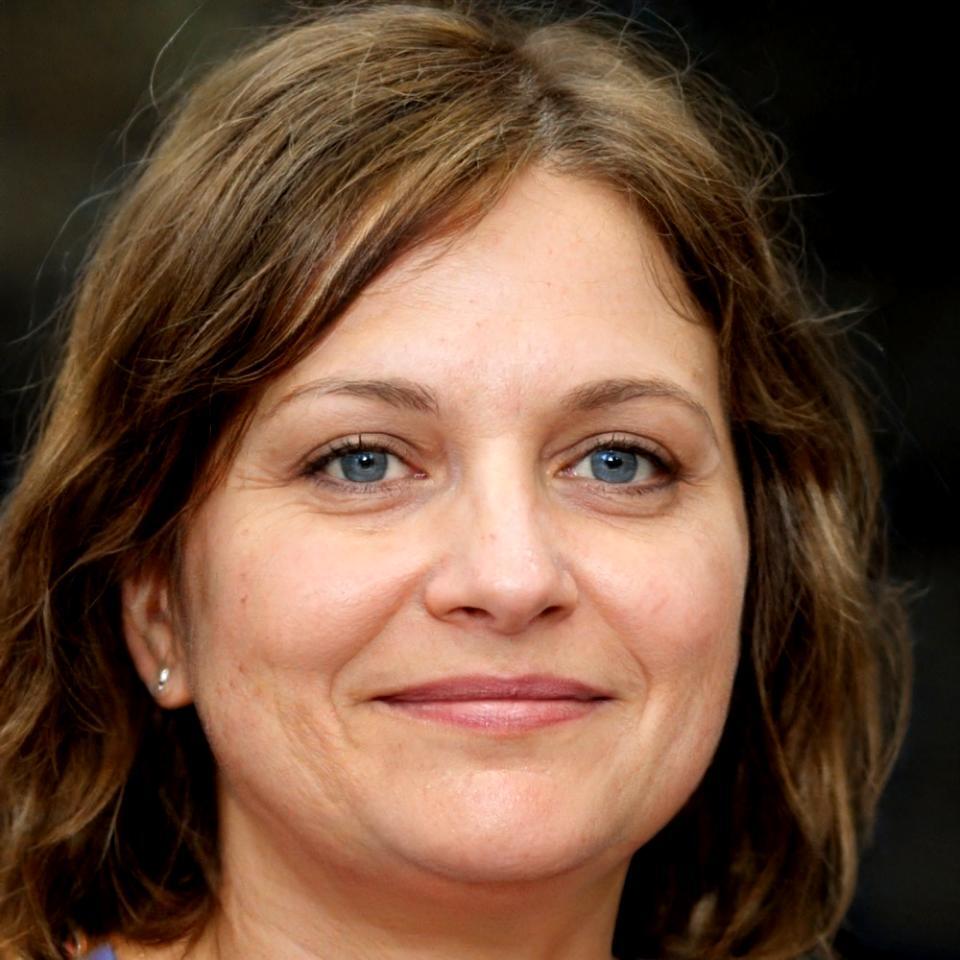 Professional headshot of Elena